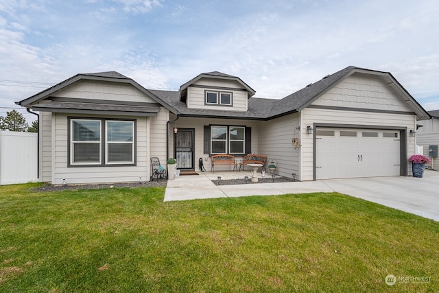 view of front of property with a front lawn and a garage