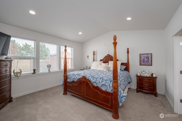 carpeted bedroom with vaulted ceiling