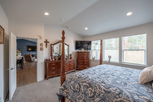 carpeted bedroom with vaulted ceiling