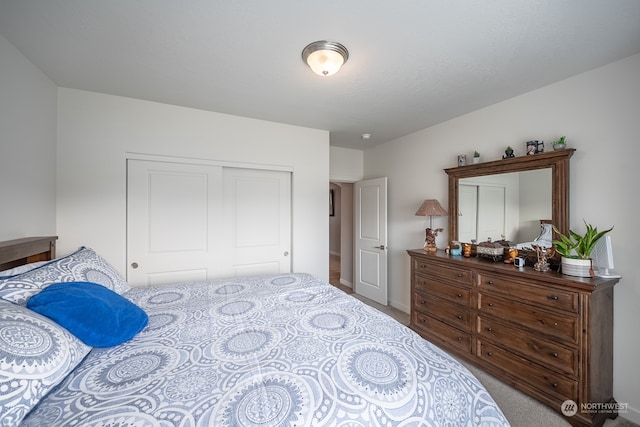 carpeted bedroom featuring a closet