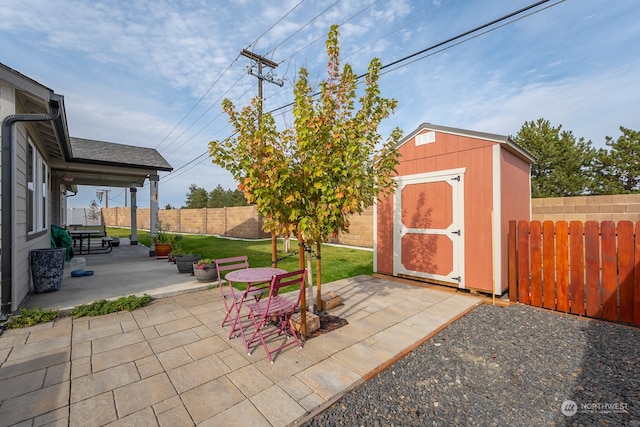 view of patio with a storage unit