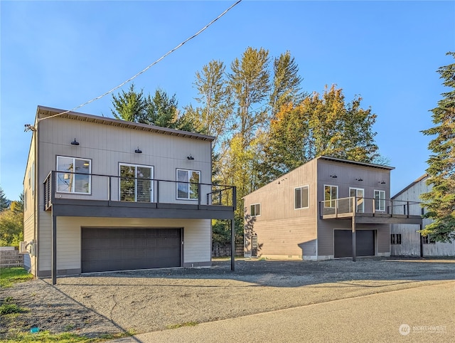 modern home featuring a balcony and a garage