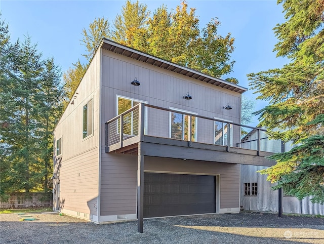 modern home with a balcony and a garage