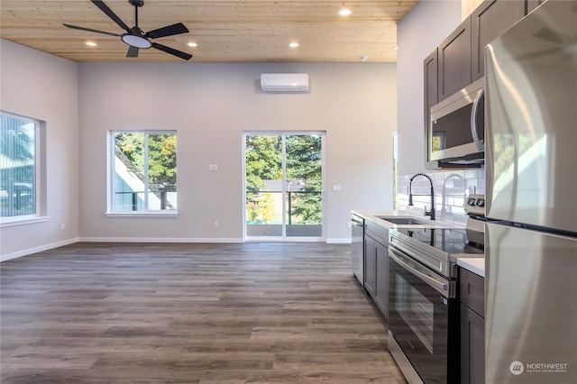 kitchen with sink, wood ceiling, stainless steel appliances, and dark hardwood / wood-style flooring