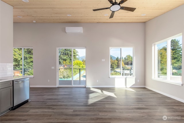 unfurnished living room with wood ceiling, a wall mounted AC, dark hardwood / wood-style floors, and ceiling fan