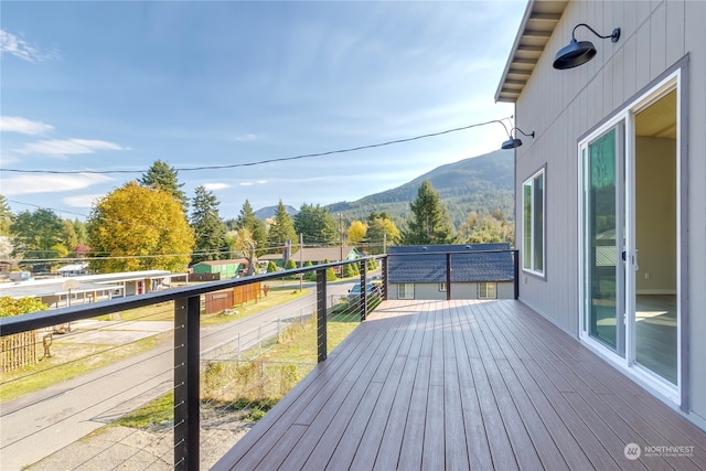 wooden deck featuring a mountain view