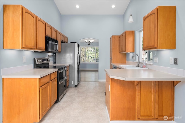 kitchen featuring a notable chandelier, appliances with stainless steel finishes, sink, and plenty of natural light