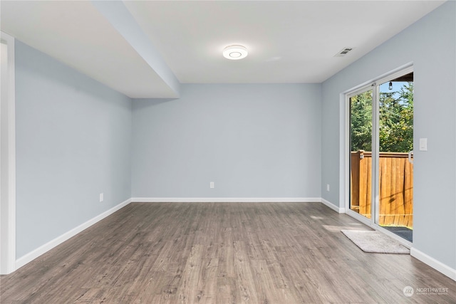 unfurnished room featuring hardwood / wood-style flooring