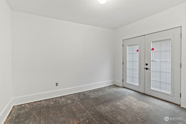 unfurnished room with french doors and dark wood-type flooring