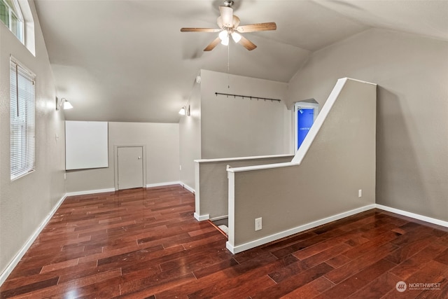 additional living space with lofted ceiling, dark hardwood / wood-style floors, and ceiling fan