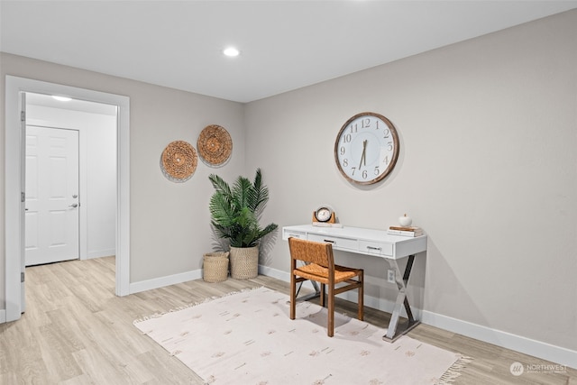 office space with light hardwood / wood-style flooring