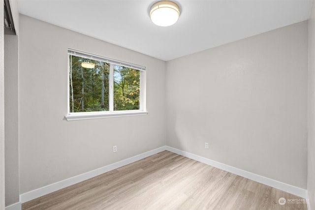 empty room with light hardwood / wood-style floors