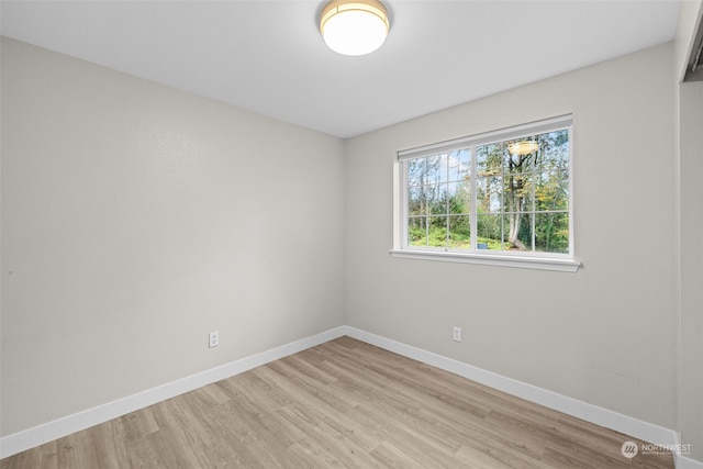 empty room with light hardwood / wood-style floors