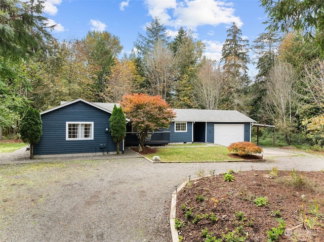 ranch-style house with a front yard and a carport