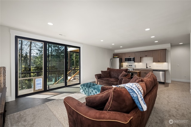 tiled living room featuring sink