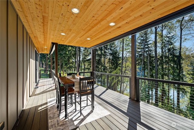 sunroom featuring wood ceiling