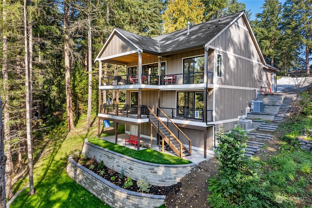 back of property with a patio and central AC unit