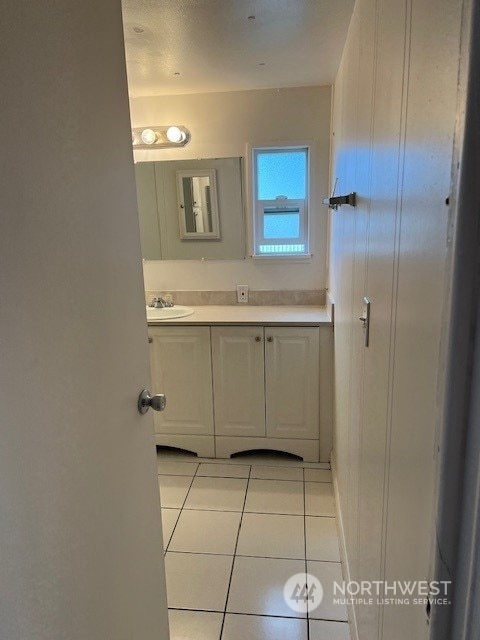 bathroom with vanity and tile patterned floors