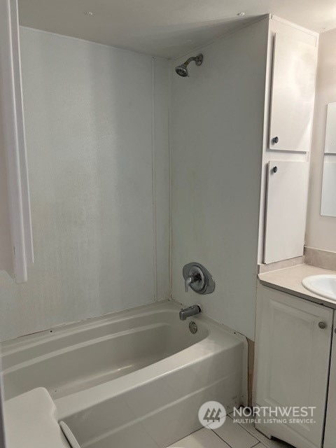 bathroom with vanity, tile patterned flooring, and tub / shower combination