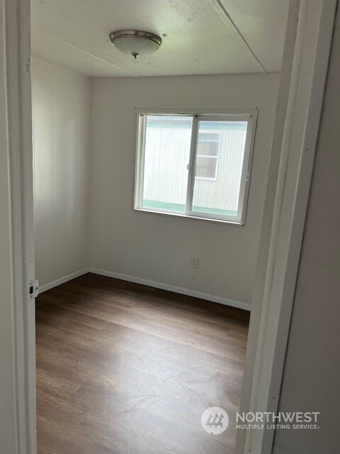 spare room with light hardwood / wood-style flooring