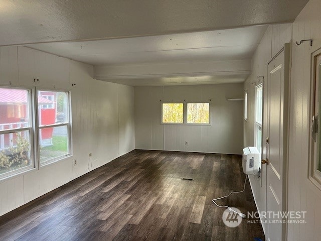 105 Cox Unit 12, Arlington, WA 98223 - unfurnished room with wood finished floors and beam ceiling
