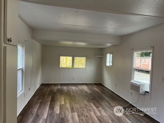 105 Cox Unit 12, Arlington, WA 98223 - empty room featuring wood finished floors, plenty of natural light, beamed ceiling, and cooling unit