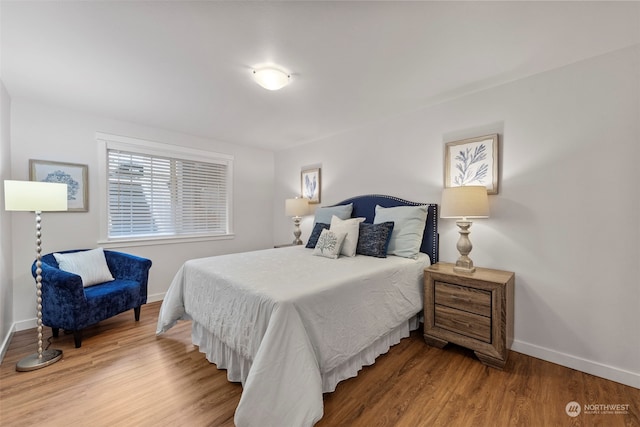 bedroom featuring hardwood / wood-style flooring