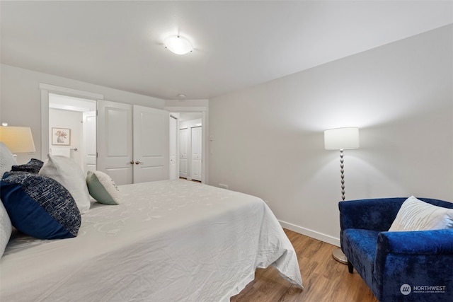 bedroom with hardwood / wood-style flooring