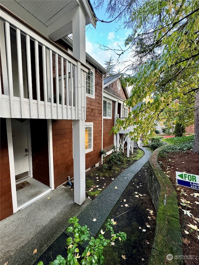 view of home's exterior with a balcony