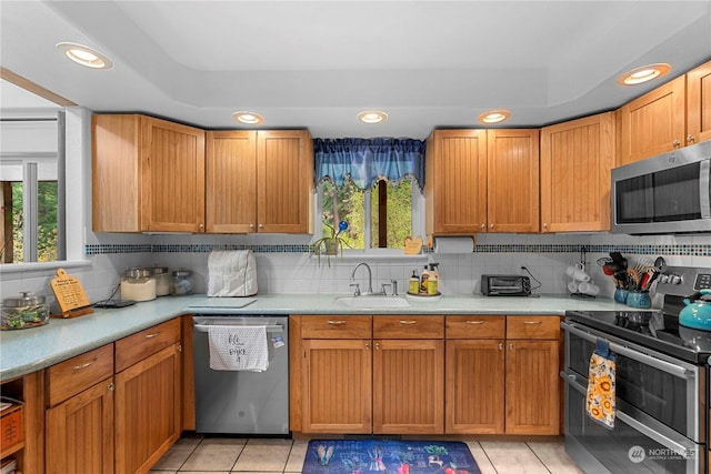 456 Hinthorne Ln, Leavenworth, WA 98826 - kitchen featuring appliances with stainless steel finishes, light countertops, decorative backsplash, light tile patterned floors, and recessed lighting