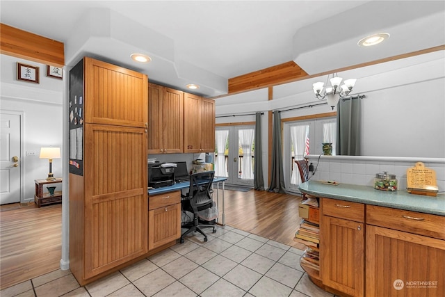 456 Hinthorne Ln, Leavenworth, WA 98826 - office area featuring light tile patterned flooring, french doors, a chandelier, recessed lighting, and built in study area
