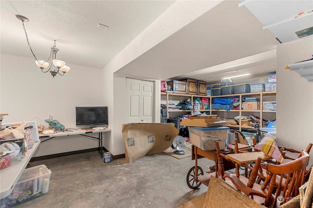 456 Hinthorne Ln, Leavenworth, WA 98826 - office area featuring unfinished concrete floors, a chandelier, and a textured ceiling