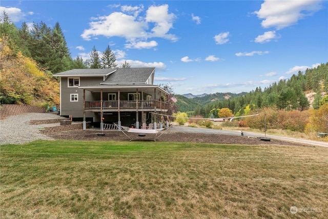 456 Hinthorne Ln, Leavenworth, WA 98826 - back of property featuring a lawn, roof with shingles, and a deck