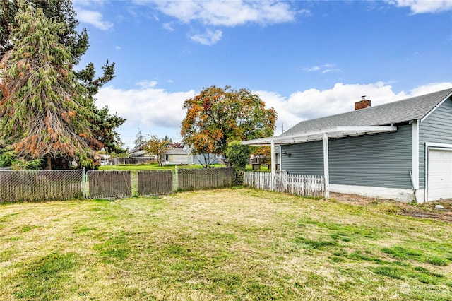 view of yard with a garage