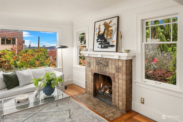 sunroom featuring a fireplace