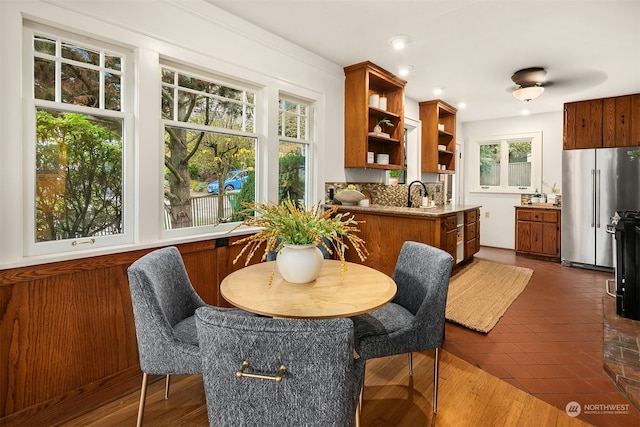 dining room with sink and dark wood-type flooring