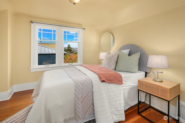 bedroom featuring wood-type flooring