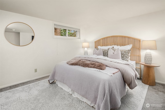 bedroom with light colored carpet