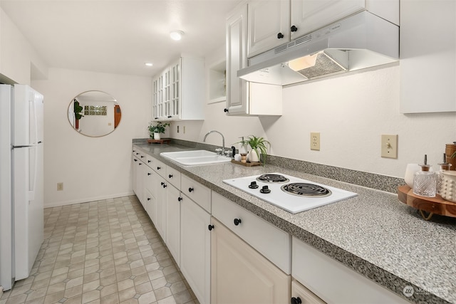 kitchen featuring white appliances, white cabinetry, and sink