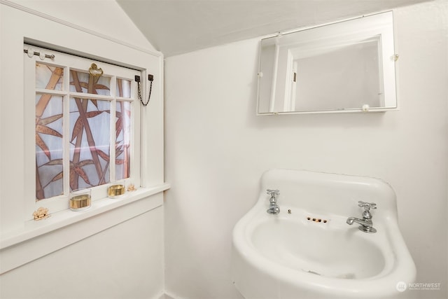 bathroom with lofted ceiling