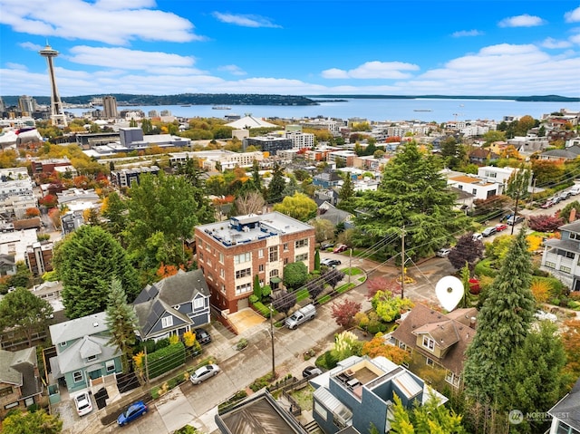 birds eye view of property with a water view