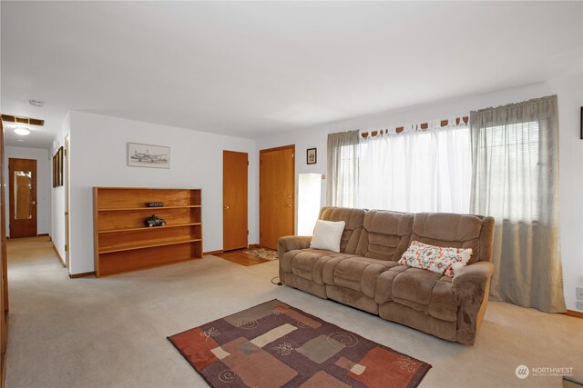 living room featuring light carpet