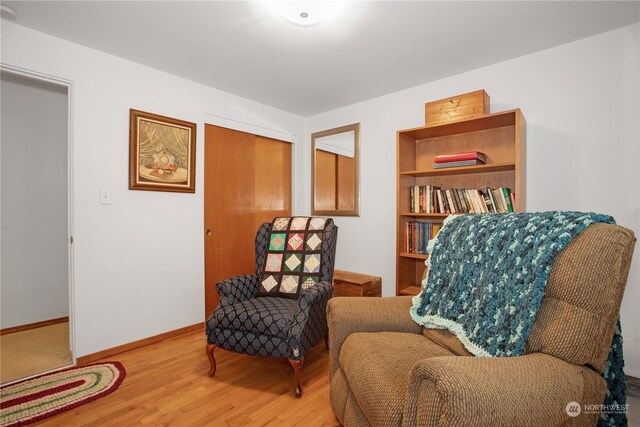 living area with hardwood / wood-style flooring