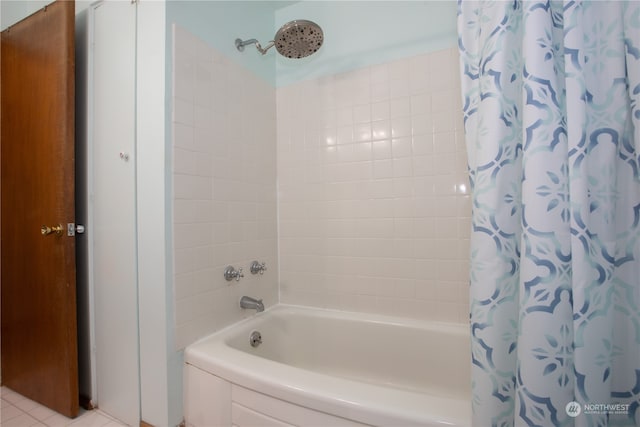 bathroom with shower / bath combo and tile patterned floors