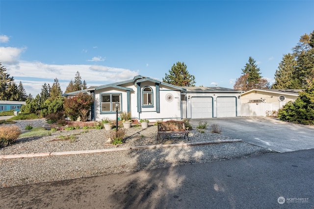 ranch-style home featuring a garage