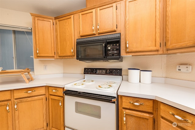 kitchen with white range with electric cooktop