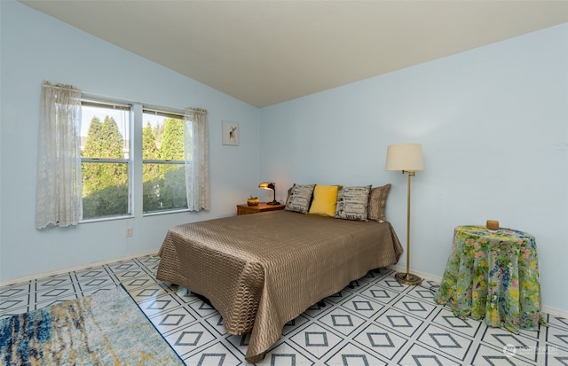 tiled bedroom with vaulted ceiling