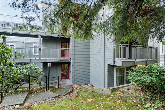 back of property with a balcony