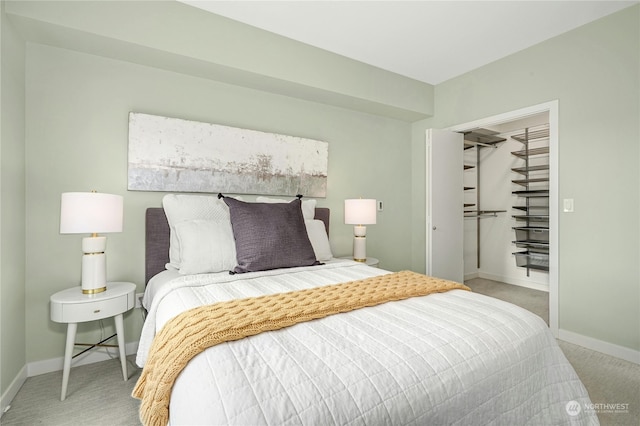 bedroom featuring a closet and light carpet