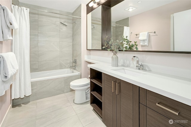 full bathroom featuring vanity, shower / tub combo, toilet, and tile patterned flooring